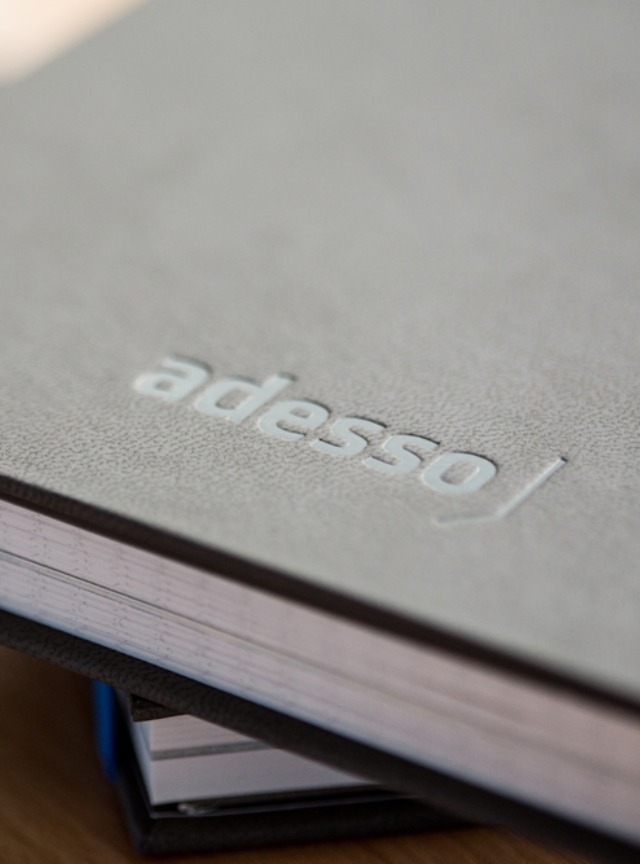 Book with adesso Logo